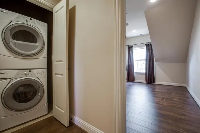 a view of a hallway with washer and dryer