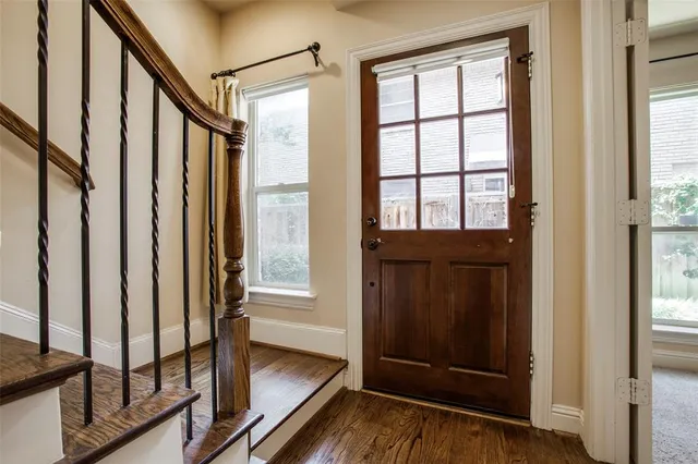 a view of front door with wooden floor
