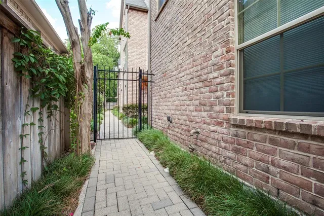 a view of a pathway both side of house