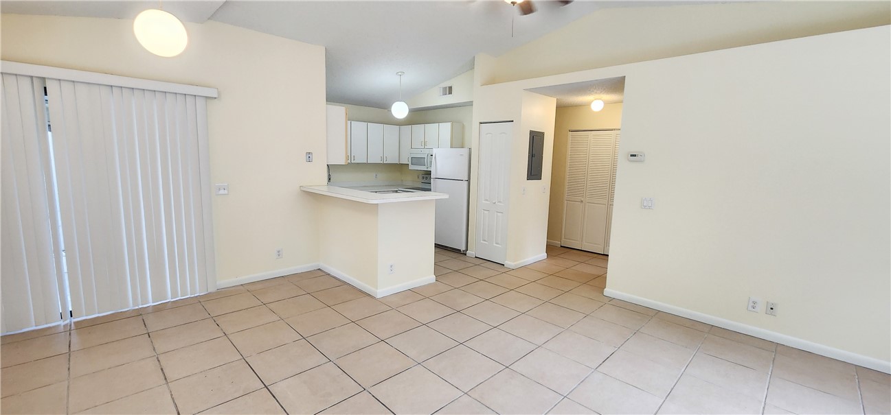 2820 Stoneway Lane, Unit C Fort Pierce, FL 34982 - Photo 2 of 13 a view of a kitchen with white cabinets