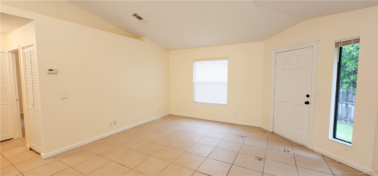2820 Stoneway Lane, Unit C Fort Pierce, FL 34982 - Photo 6 of 13 a view of an empty room with window