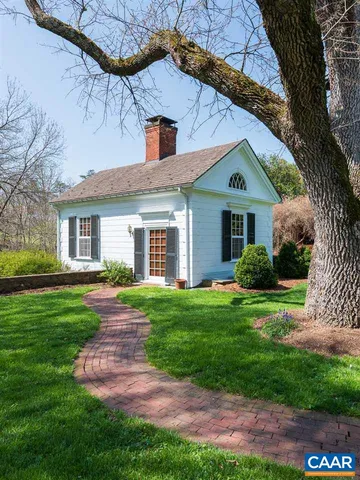 a front view of house with yard and outdoor seating