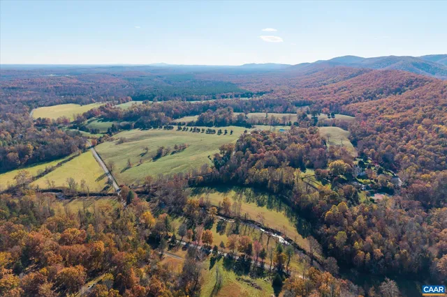 an aerial view of a house with outdoor space