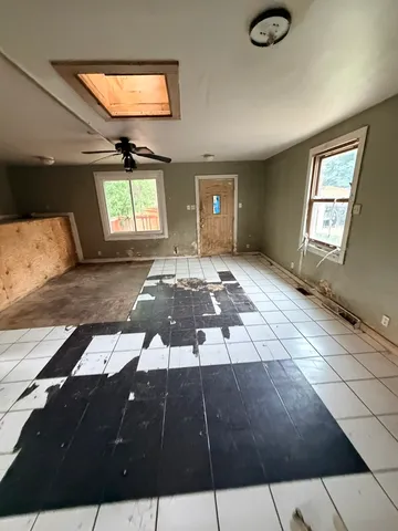 a living room with a black white checkered floor
