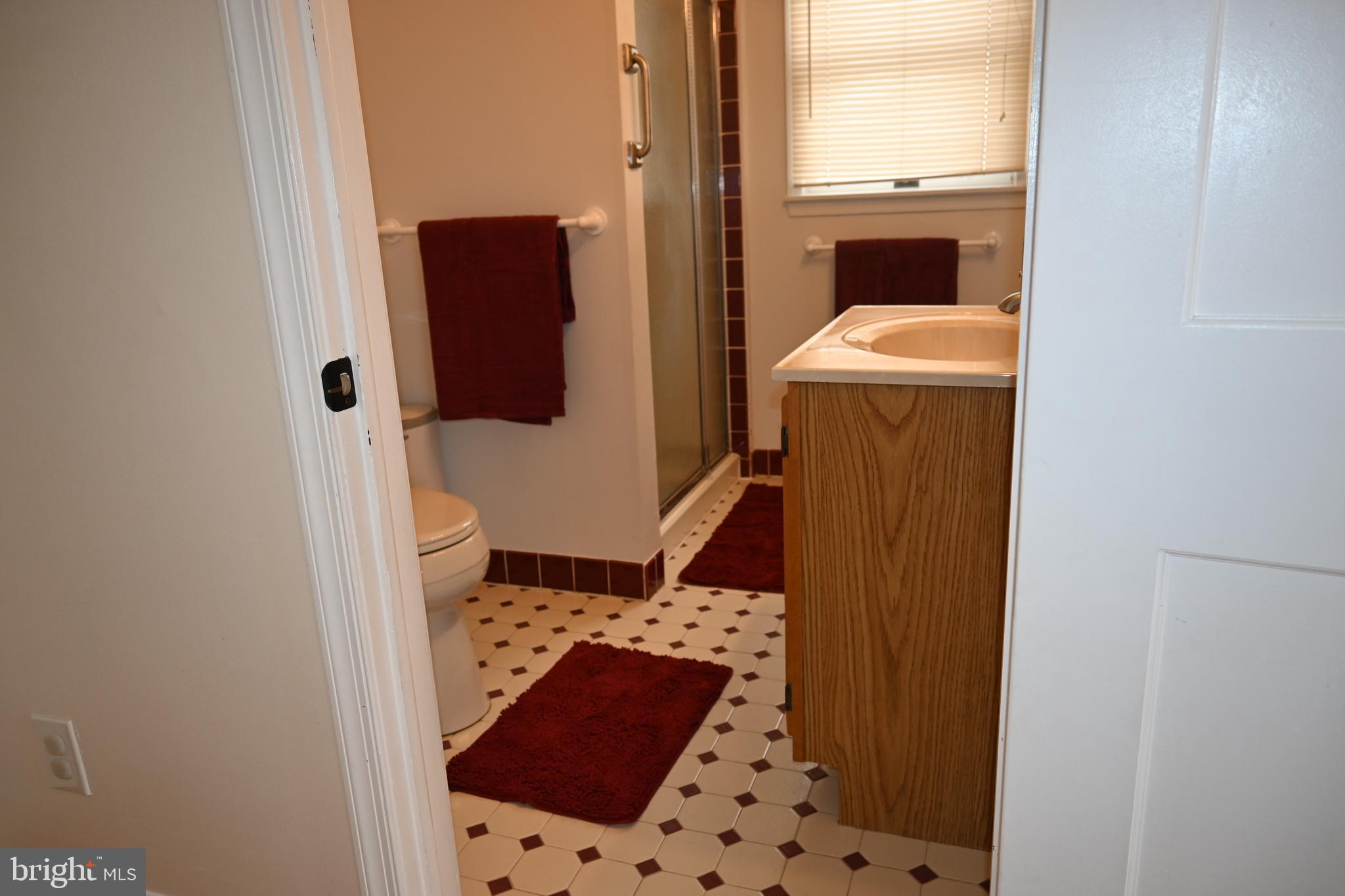 514 Springview Lane Springfield, PA 19064 - Photo 16 of 33 a bathroom with a sink and mirror