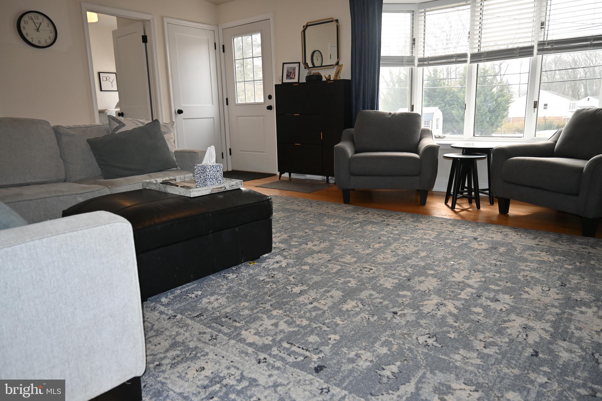 514 Springview Lane Springfield, PA 19064 - Photo 19 of 33 a living room with furniture and large windows
