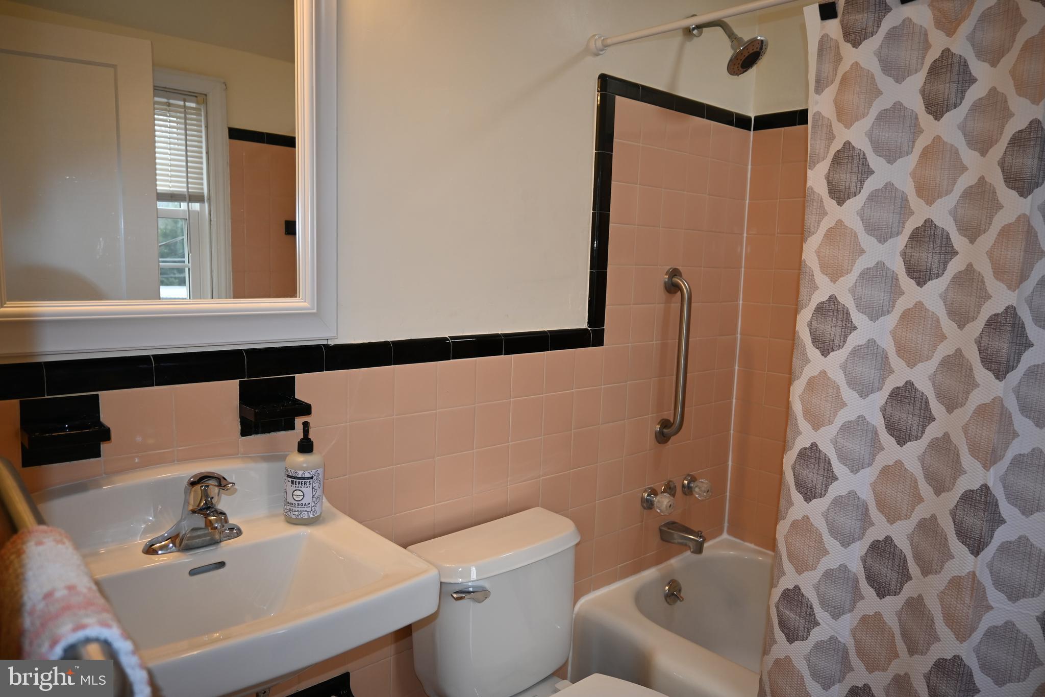 514 Springview Lane Springfield, PA 19064 - Photo 20 of 33 a bathroom with a sink toilet and a mirror