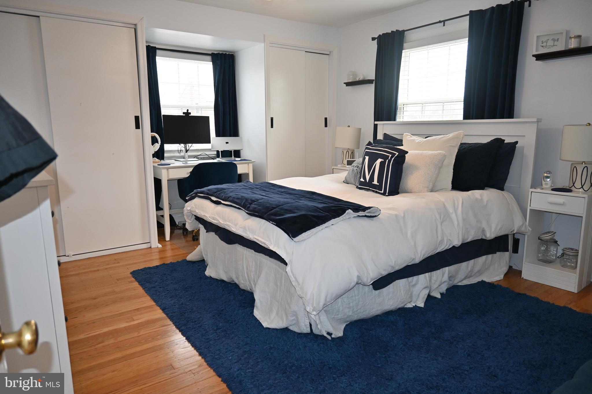 514 Springview Lane Springfield, PA 19064 - Photo 21 of 33 a bedroom with a bed and wooden floor