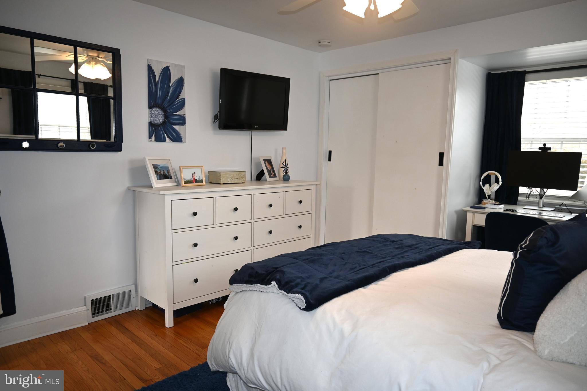 514 Springview Lane Springfield, PA 19064 - Photo 22 of 33 a bedroom with a bed and a flat screen tv