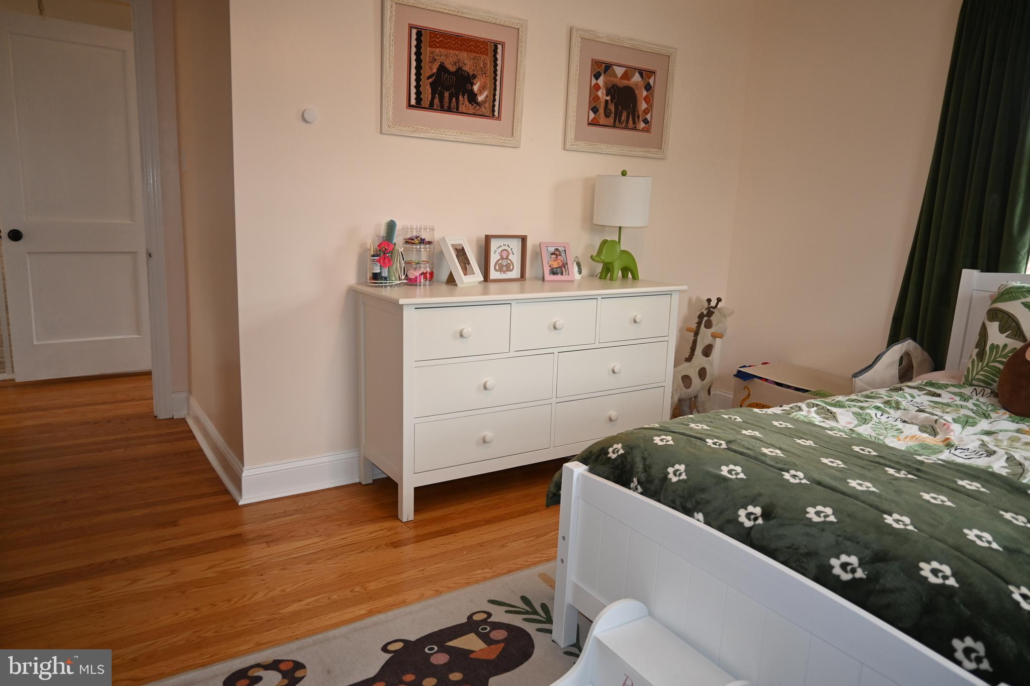 514 Springview Lane Springfield, PA 19064 - Photo 23 of 33 a bedroom with a bed and wooden floor