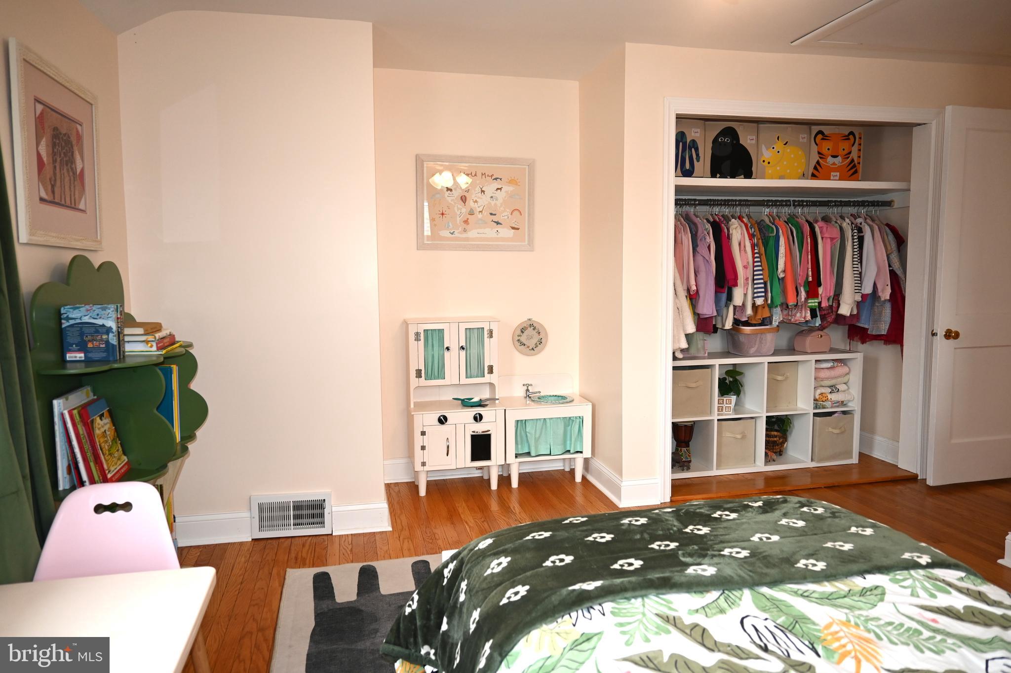 514 Springview Lane Springfield, PA 19064 - Photo 24 of 33 a bedroom with furniture and a book shelf