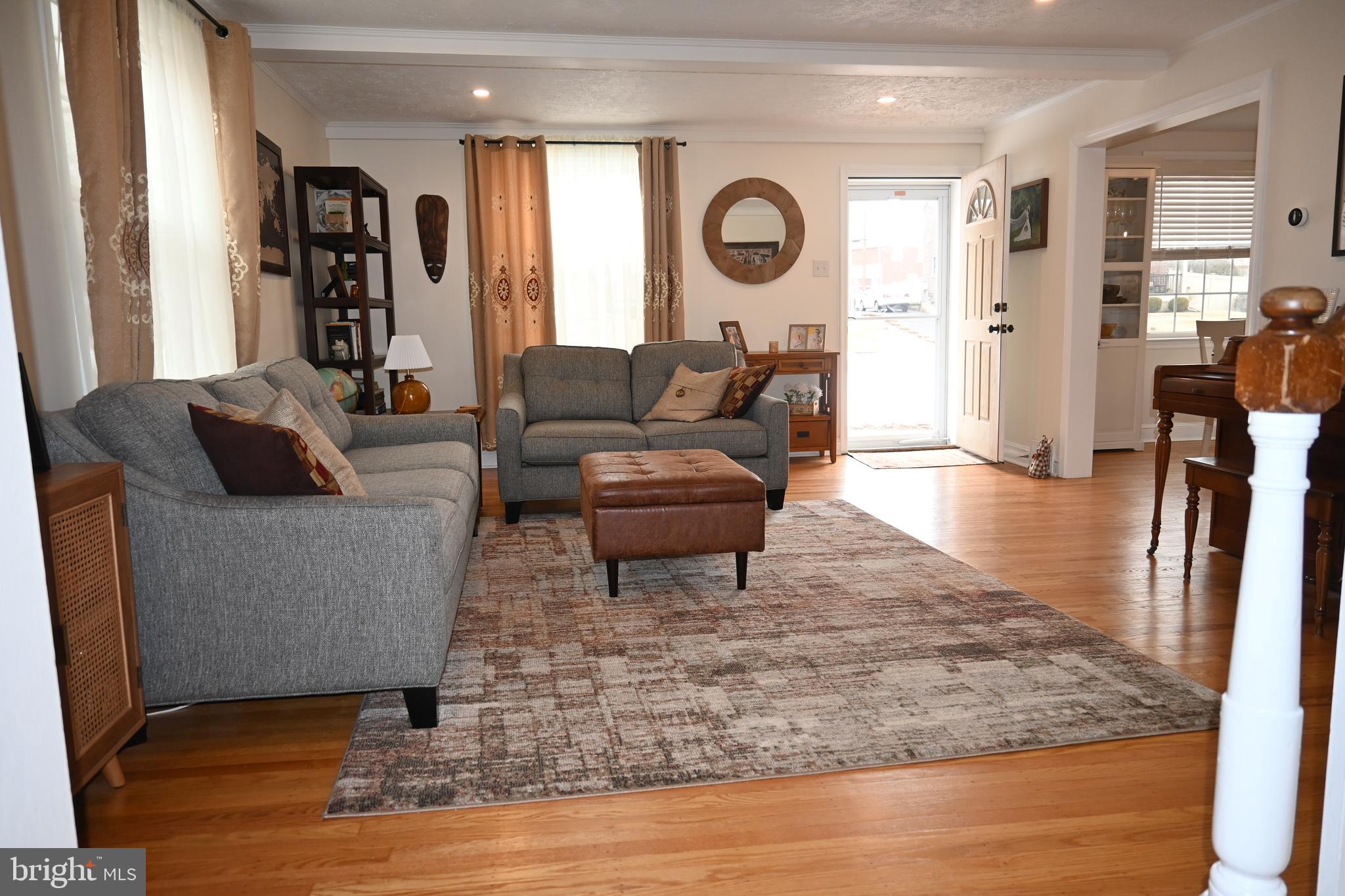 514 Springview Lane Springfield, PA 19064 - Photo 4 of 33 a living room with furniture and a wooden floor