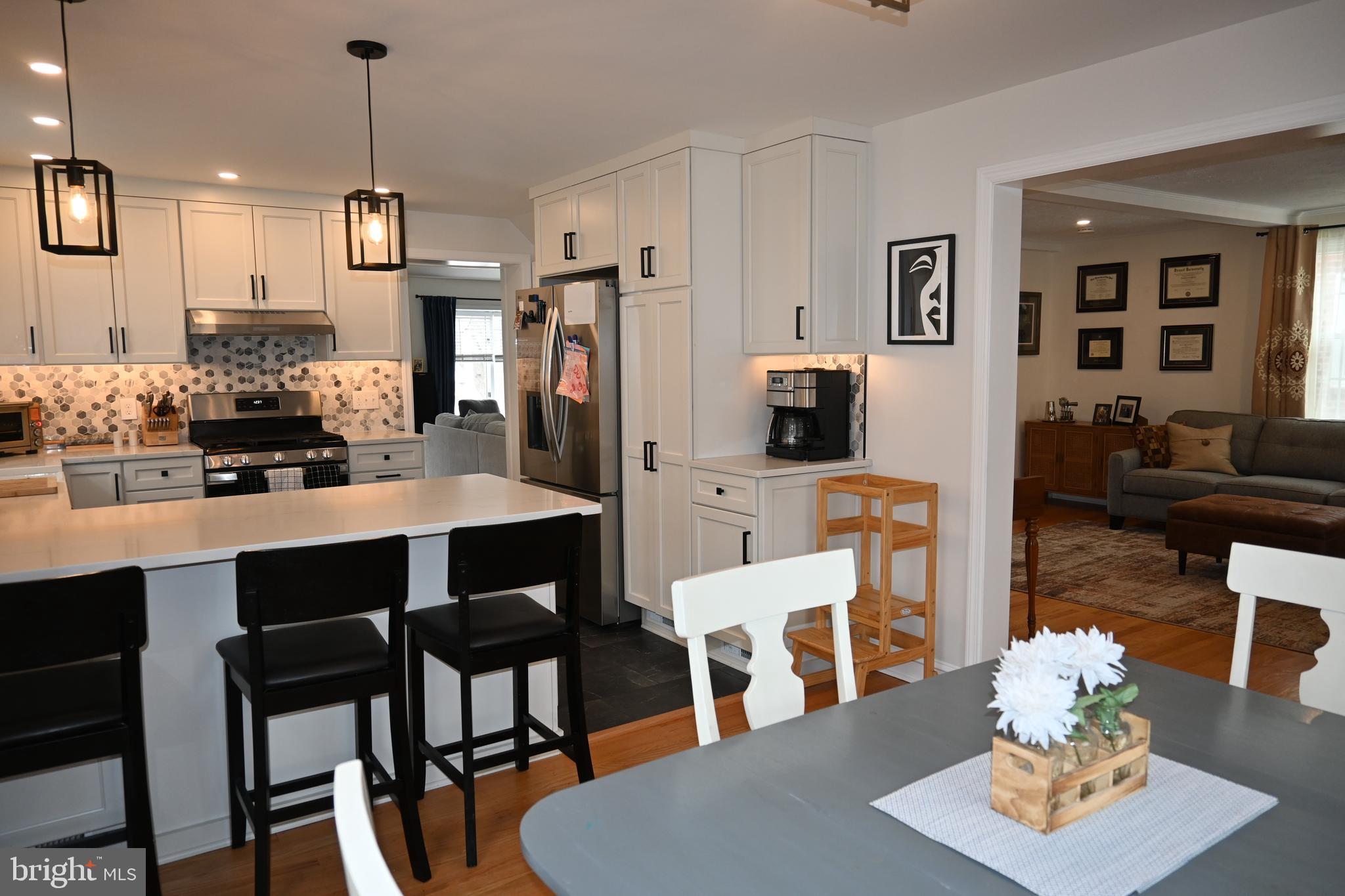 514 Springview Lane Springfield, PA 19064 - Photo 8 of 33 a view of a dining room with furniture and wooden floor