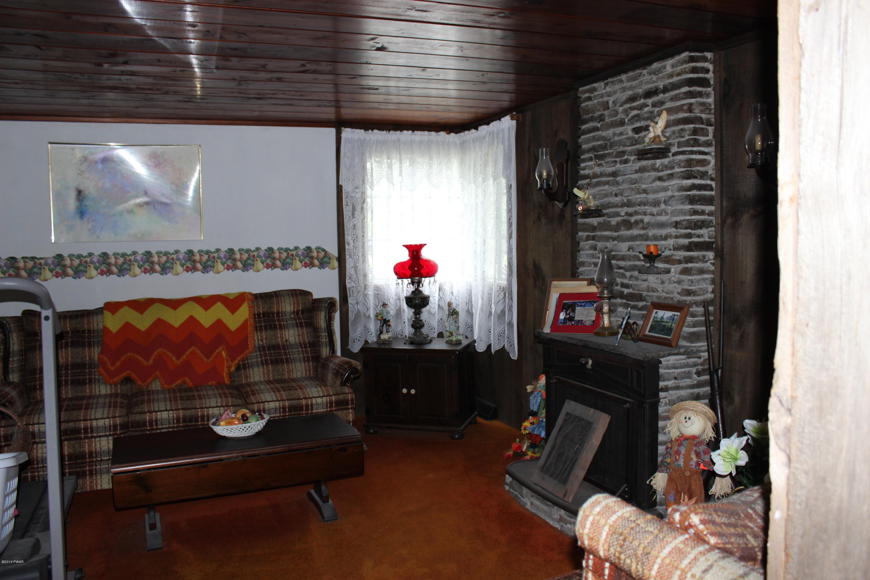 2465 Aberdeen Road Moscow, PA 18444 - Photo 5 of 21 a room with furniture and a fireplace