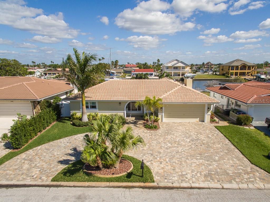 5440 Leeward Lane New Port Richey, FL 34652 - Photo 1 of 1 Front of the house with view of the canal