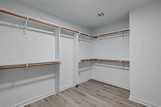 a view of an empty walk in closet