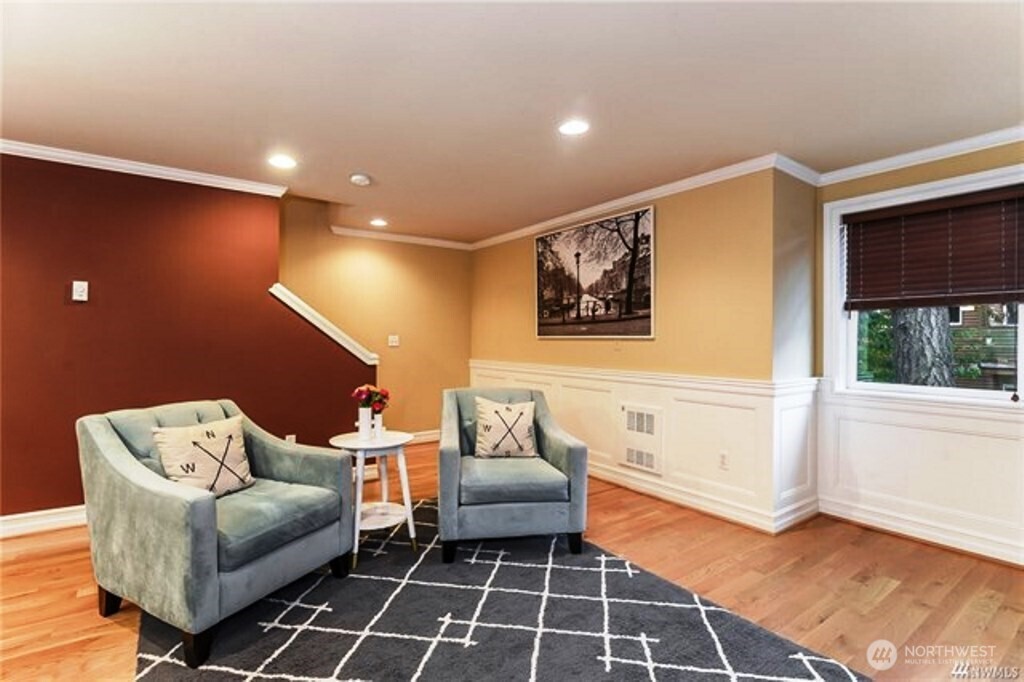 725 North 95th Street, Unit C Seattle, WA 98103 - Photo 5 of 18 a living room with furniture and a rug