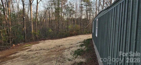 a view of a backyard of the house