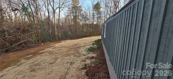 a view of a backyard with pathway