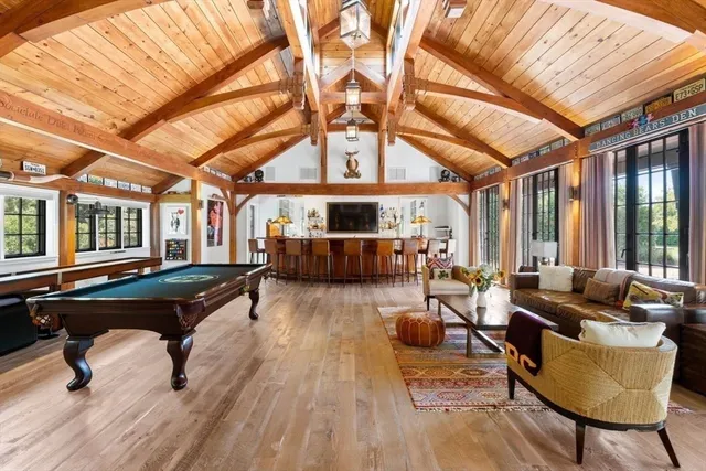 a living room with furniture and wooden floors