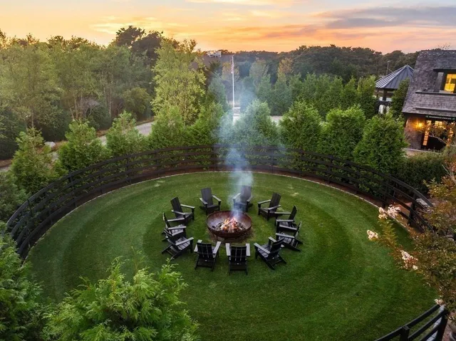 a swimming pool with trees in the background