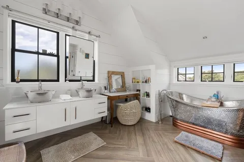 a view of a chairs and table in the patio