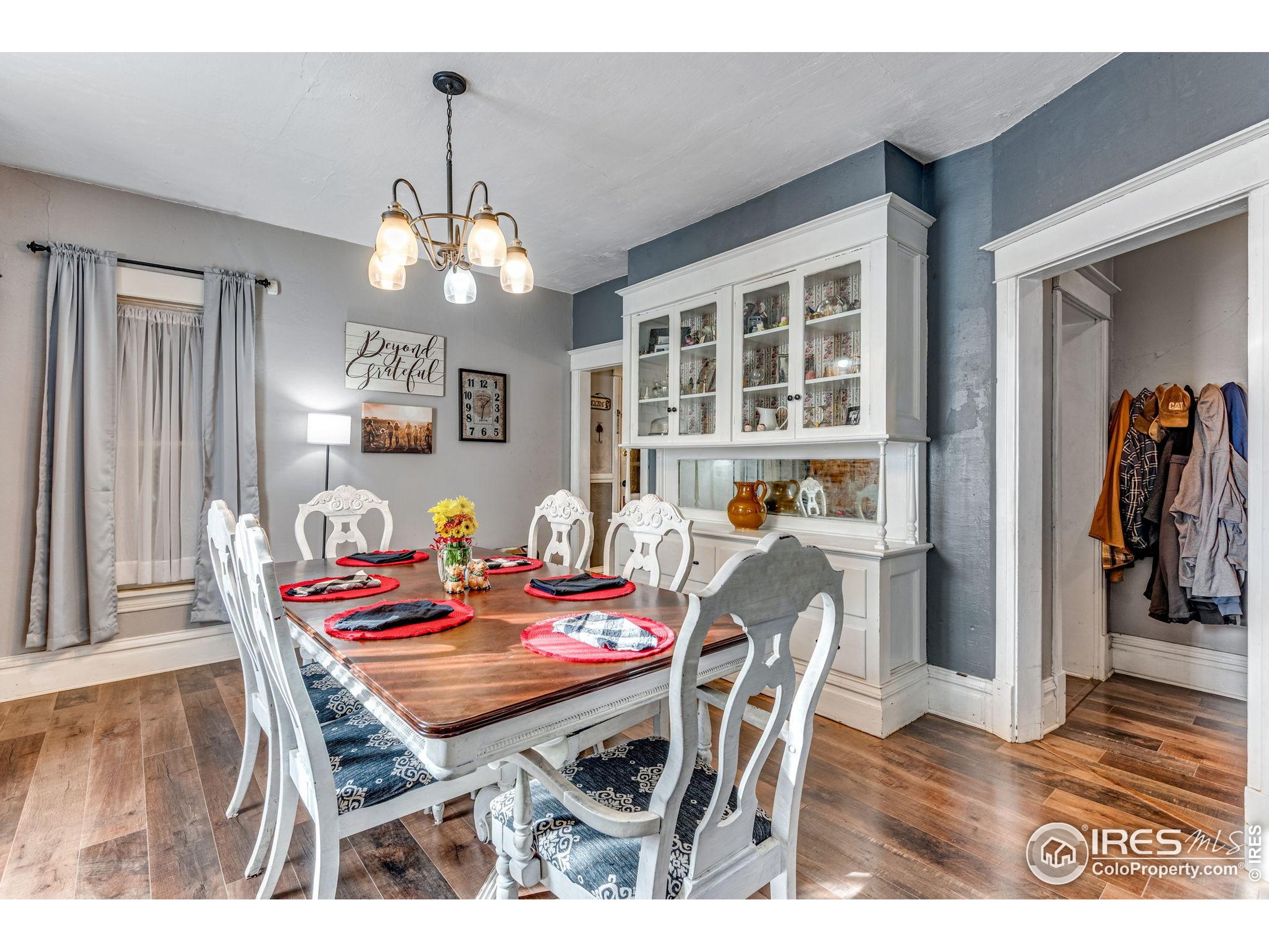 501 Maple Street Fort Morgan, CO 80701 - Photo 16 of 46 a view of a dining room with furniture and wooden floor