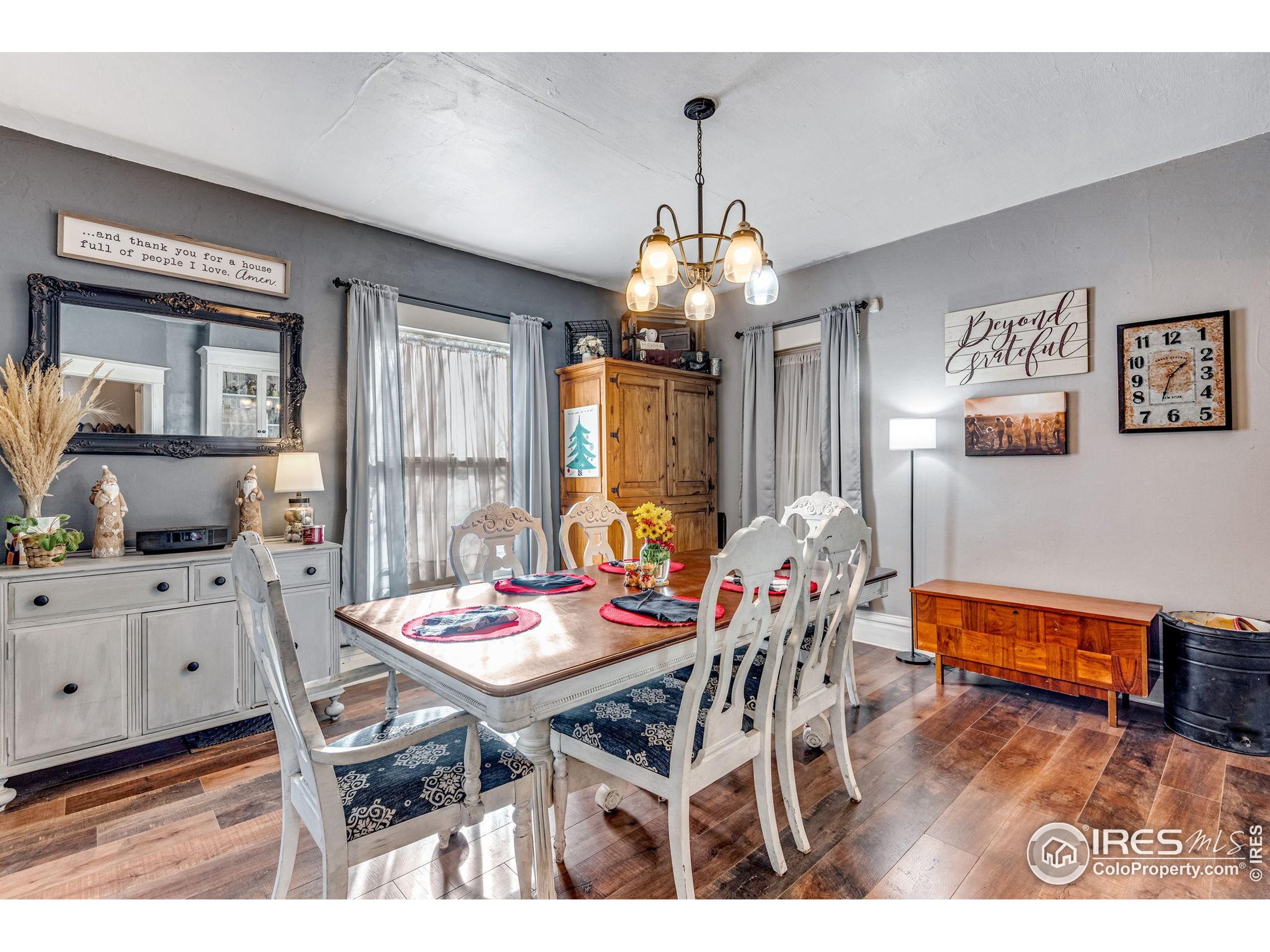 501 Maple Street Fort Morgan, CO 80701 - Photo 17 of 46 a view of a dining room with furniture window and wooden floor