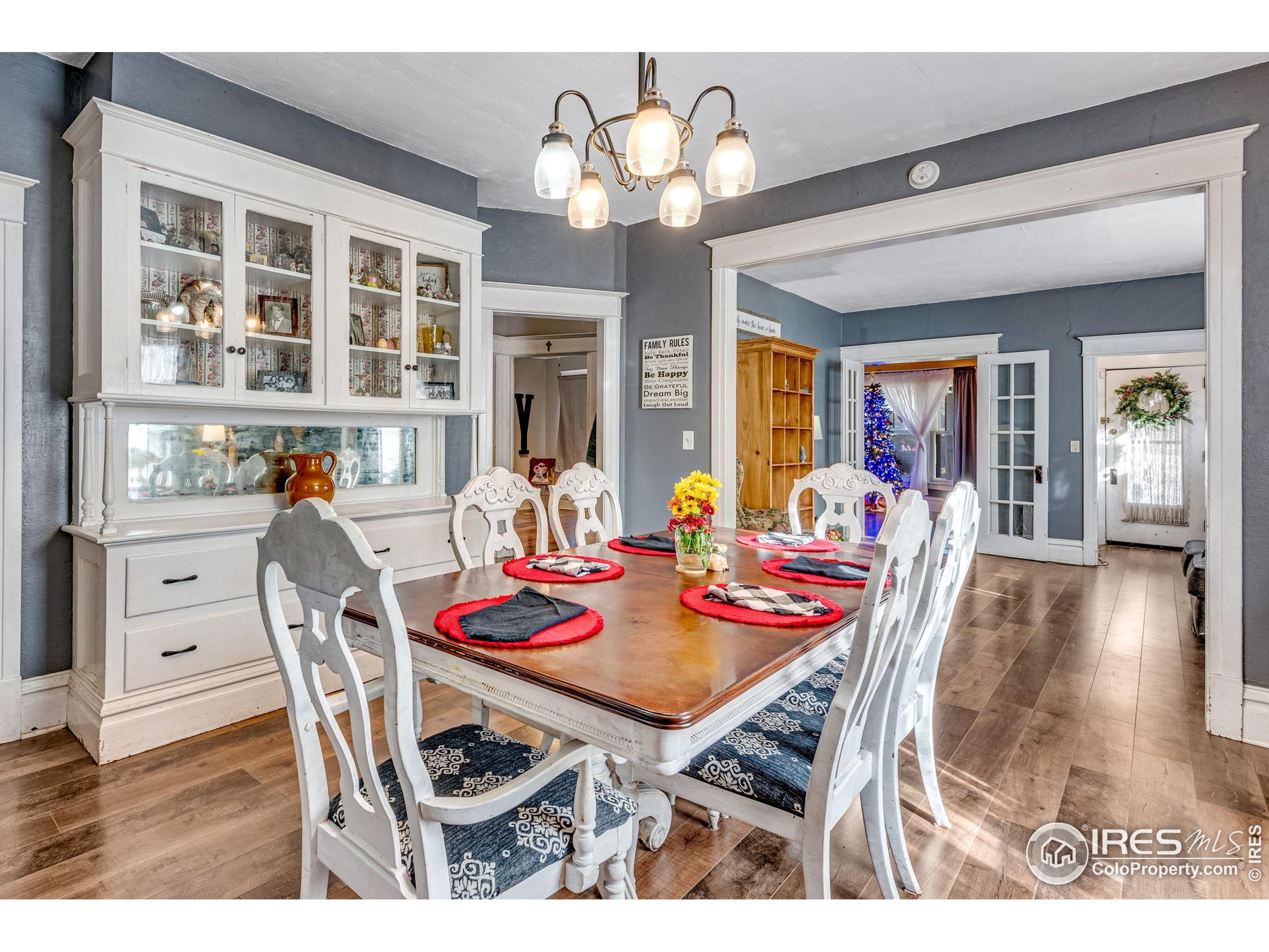 501 Maple Street Fort Morgan, CO 80701 - Photo 18 of 46 a view of a dining room with furniture and chandelier