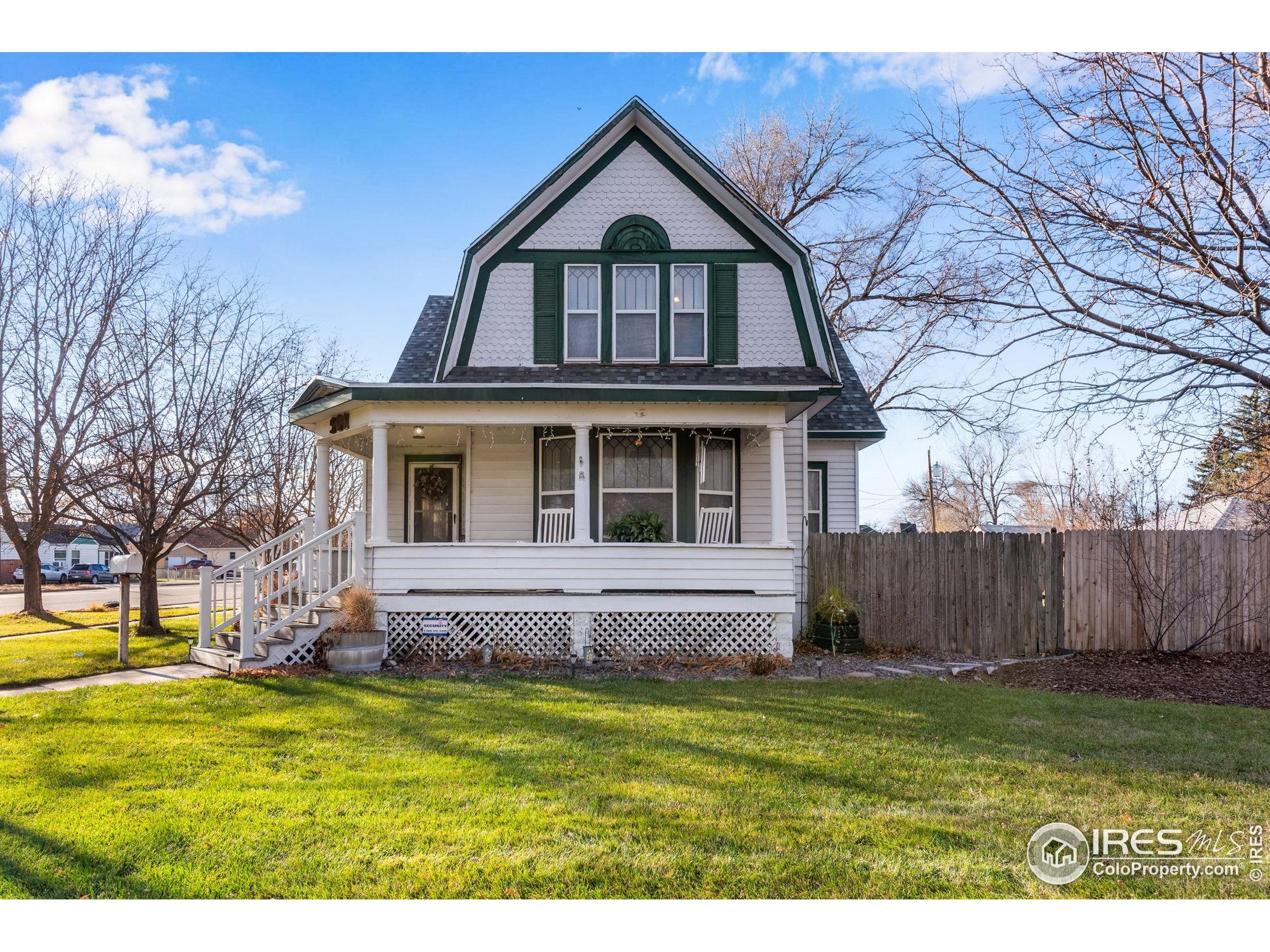 501 Maple Street Fort Morgan, CO 80701 - Photo 2 of 46 a view of a house with a yard