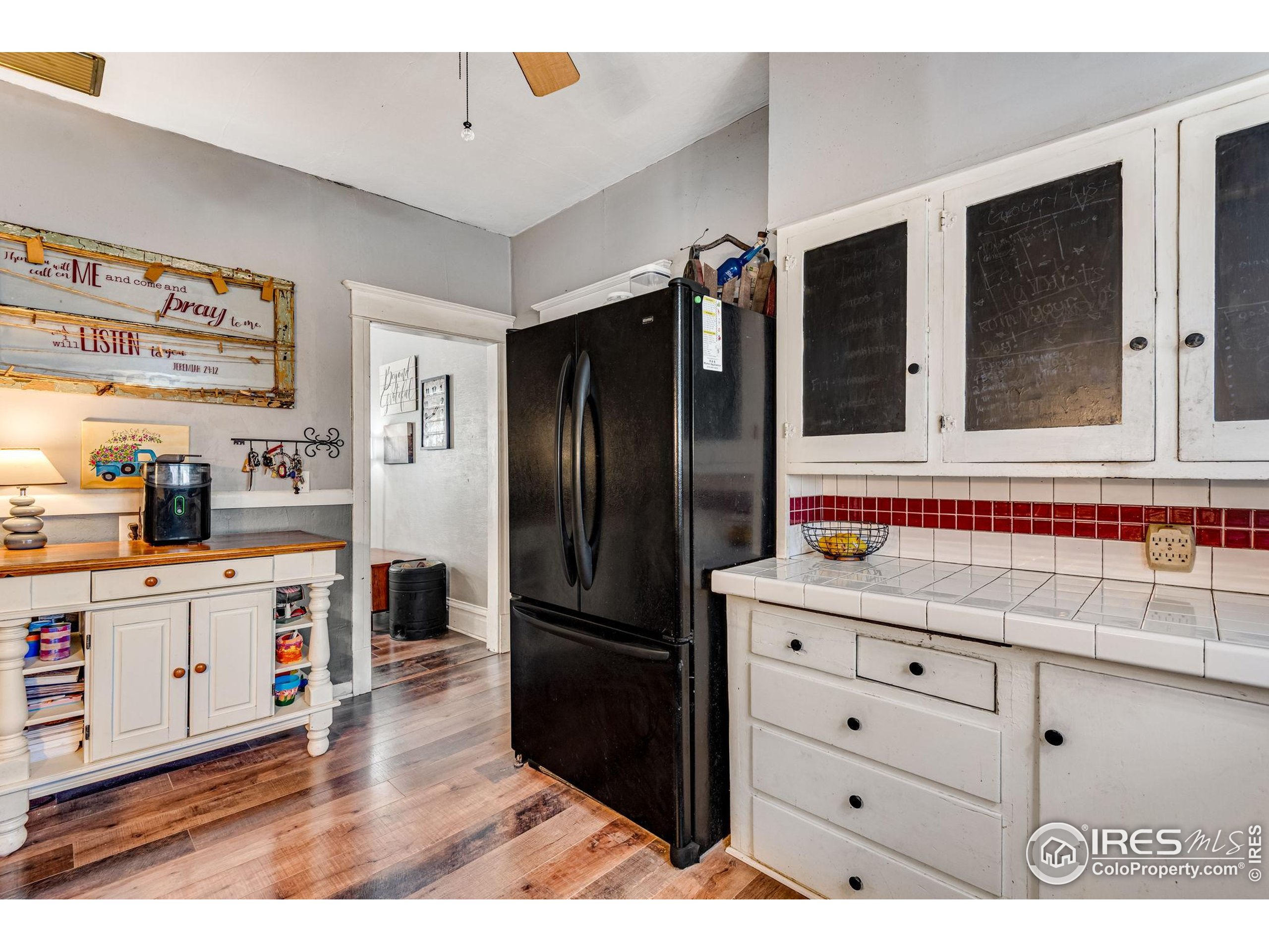 501 Maple Street Fort Morgan, CO 80701 - Photo 24 of 46 a kitchen with granite countertop a refrigerator and a sink
