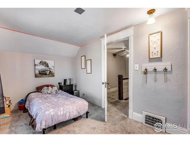 a bedroom with a bed and a view of bathroom