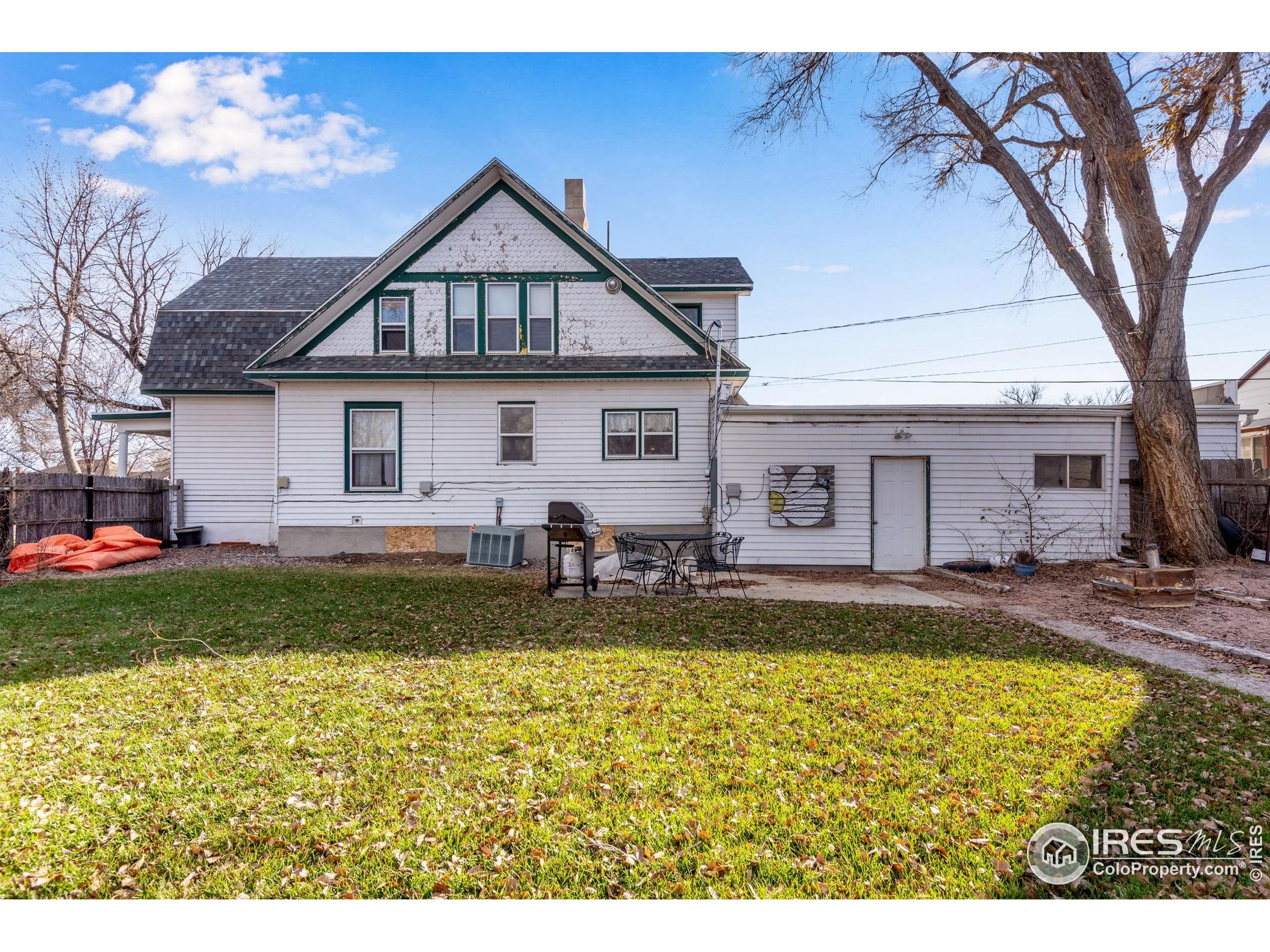 501 Maple Street Fort Morgan, CO 80701 - Photo 43 of 46 a view of a house with a swimming pool and a yard