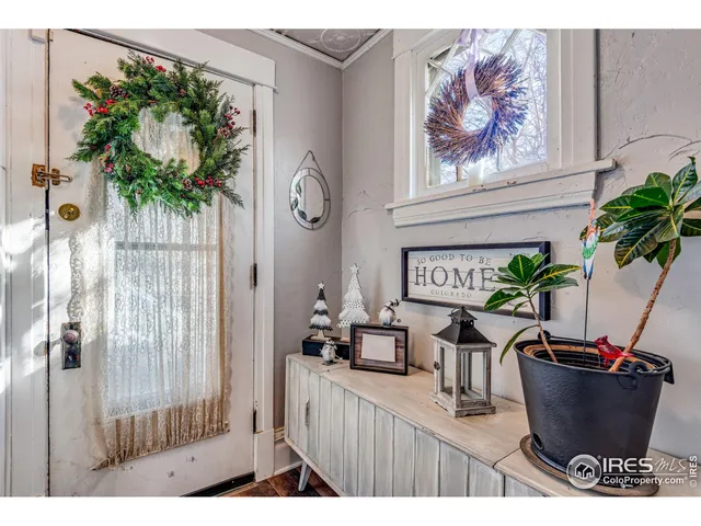 a view of a living room and a potted plant