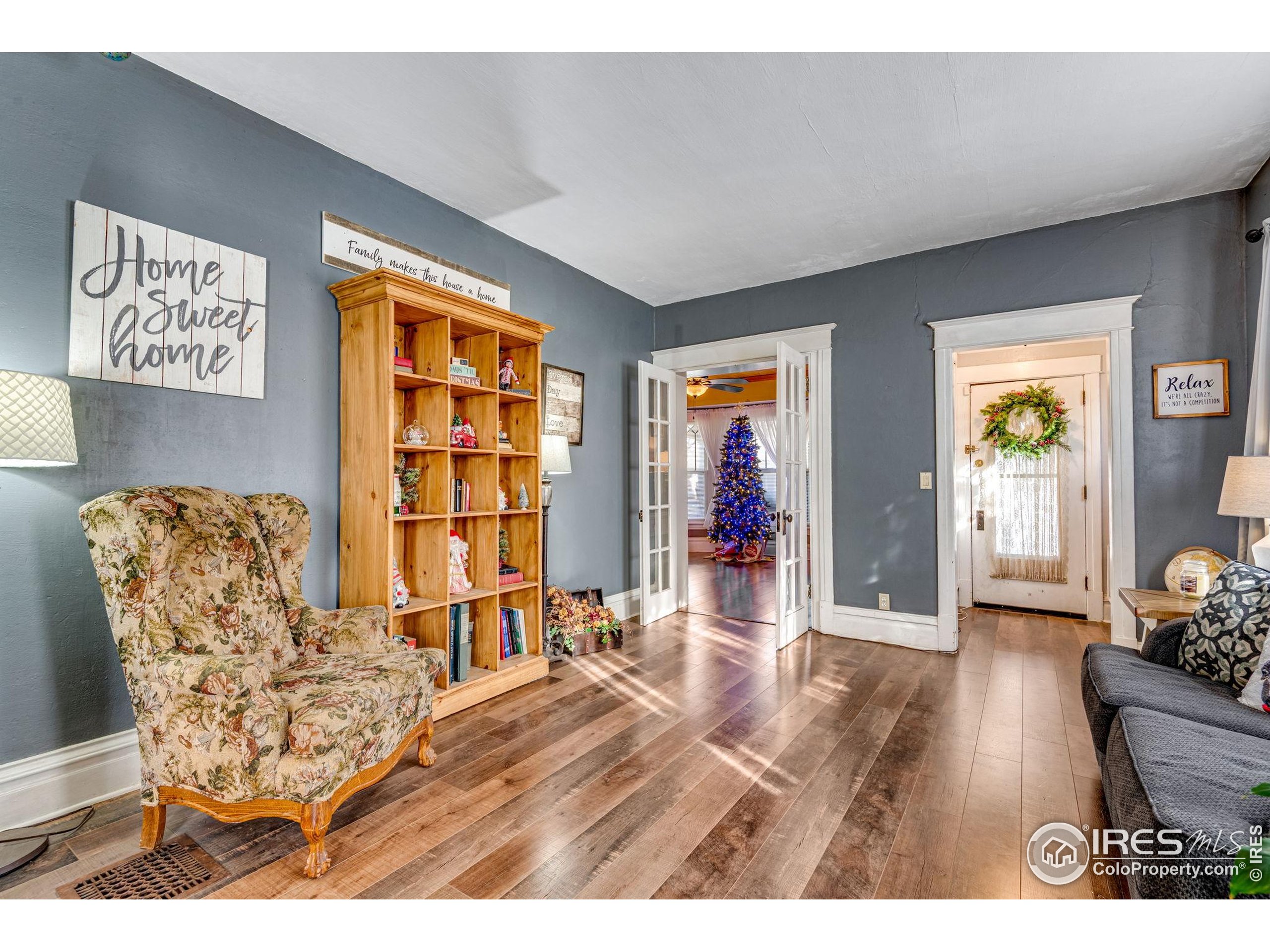 501 Maple Street Fort Morgan, CO 80701 - Photo 9 of 46 a living room with furniture and a wooden floor