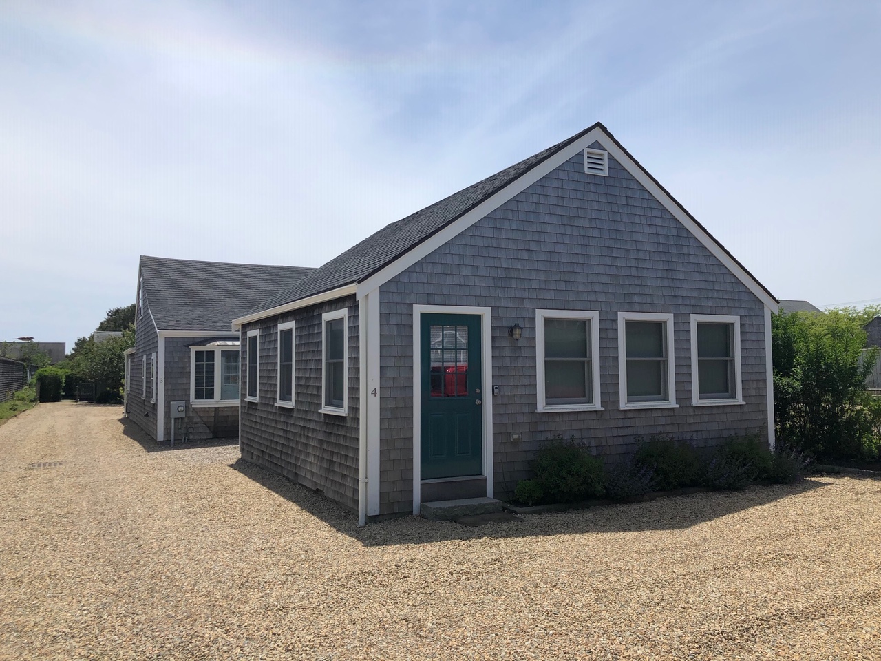 3 A Sun Island Road, Unit 4 Nantucket, MA 02554 - Photo 2 of 17 front view of a house with a yard