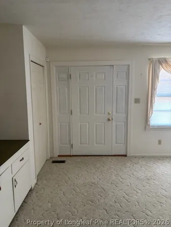 a view of room with white walls