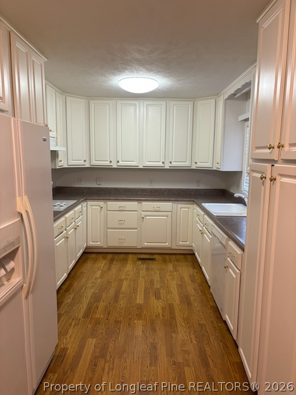 1523 Proctorville Church Road Proctorville, NC 28369 - Photo 16 of 35 a kitchen with granite countertop a refrigerator sink and cabinets