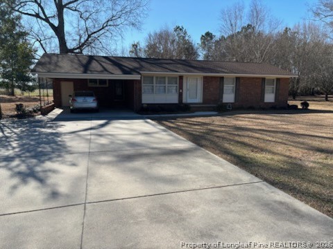 1523 Proctorville Church Road Proctorville, NC 28369 - Photo 2 of 34 a front view of a house with a yard