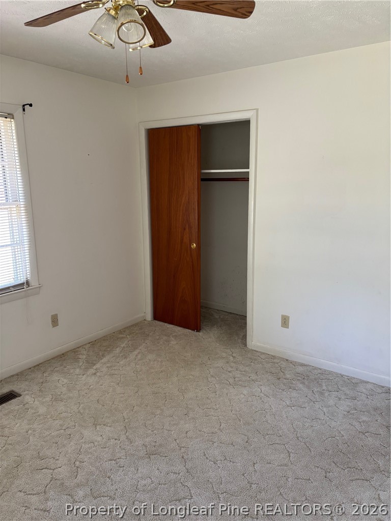 1523 Proctorville Church Road Proctorville, NC 28369 - Photo 25 of 35 an empty room with a empty space and windows