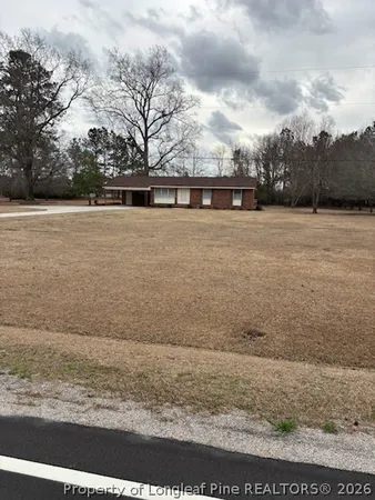 a view of swimming pool with a yard