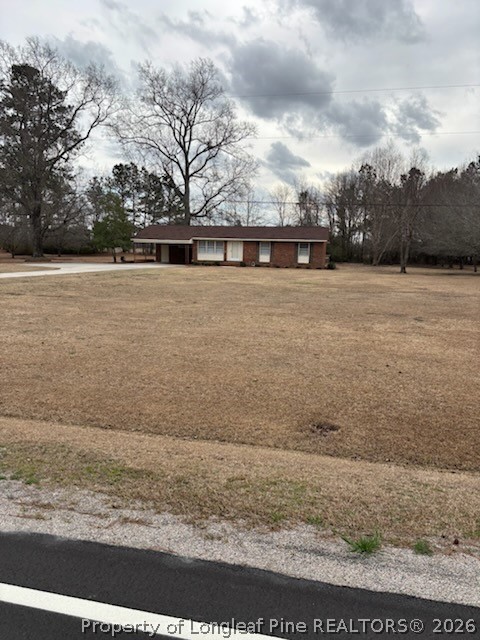 1523 Proctorville Church Road Proctorville, NC 28369 - Photo 3 of 34 a view of swimming pool with a yard
