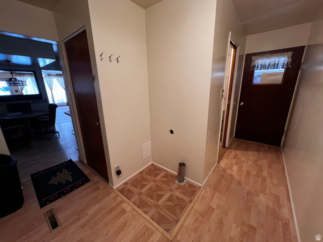 338 South 300 West Helper, UT 84526 - Photo 15 of 20 Laundry area featuring light wood finished floors and baseboards