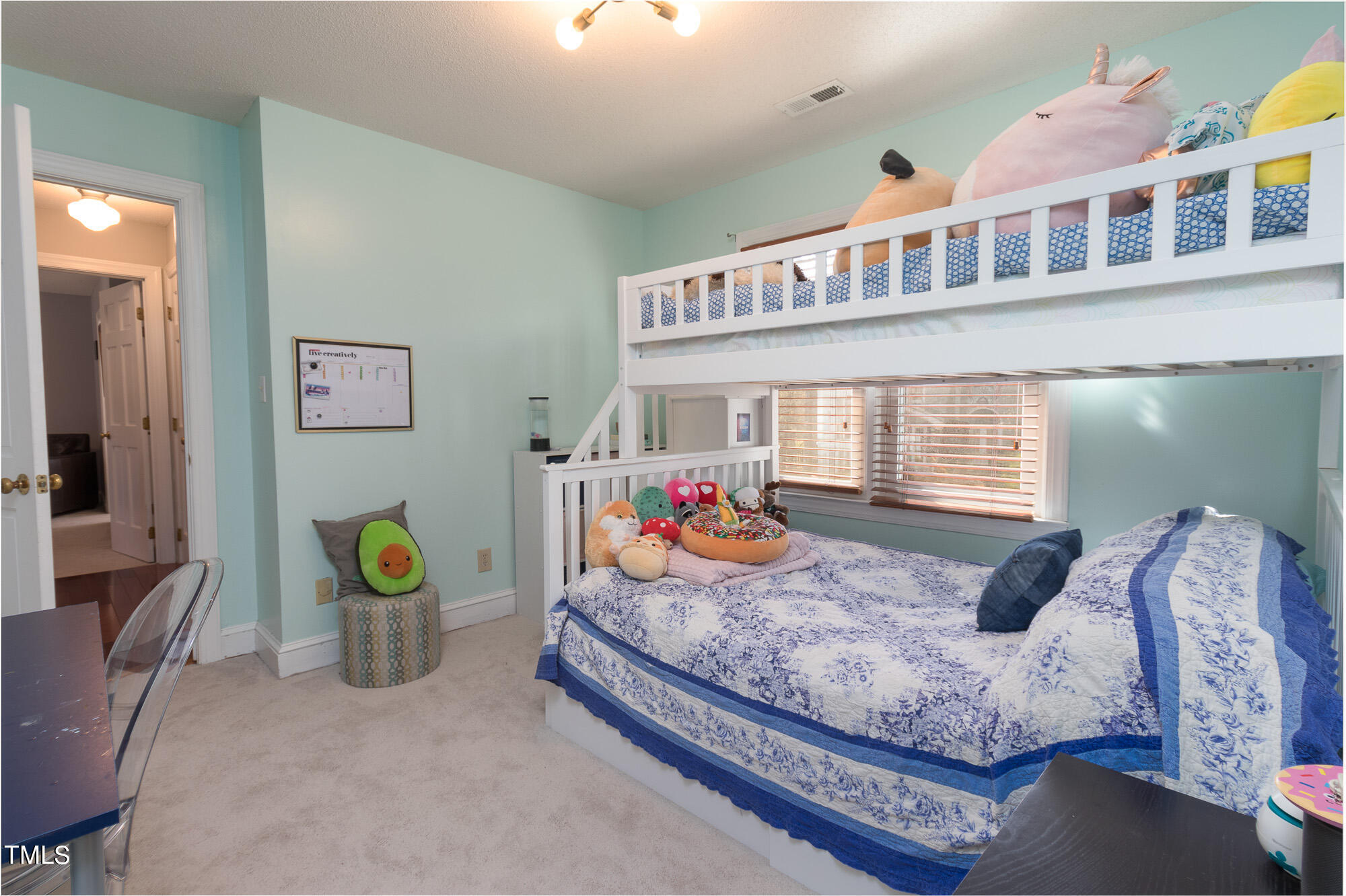 8832 Campfire Trail Raleigh, NC 27615 - Photo 12 of 19 a bedroom with bed and a window