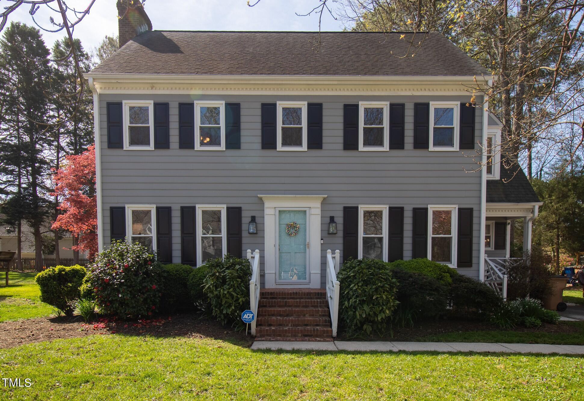 8832 Campfire Trail Raleigh, NC 27615 - Photo 2 of 19 a front view of a house with garden