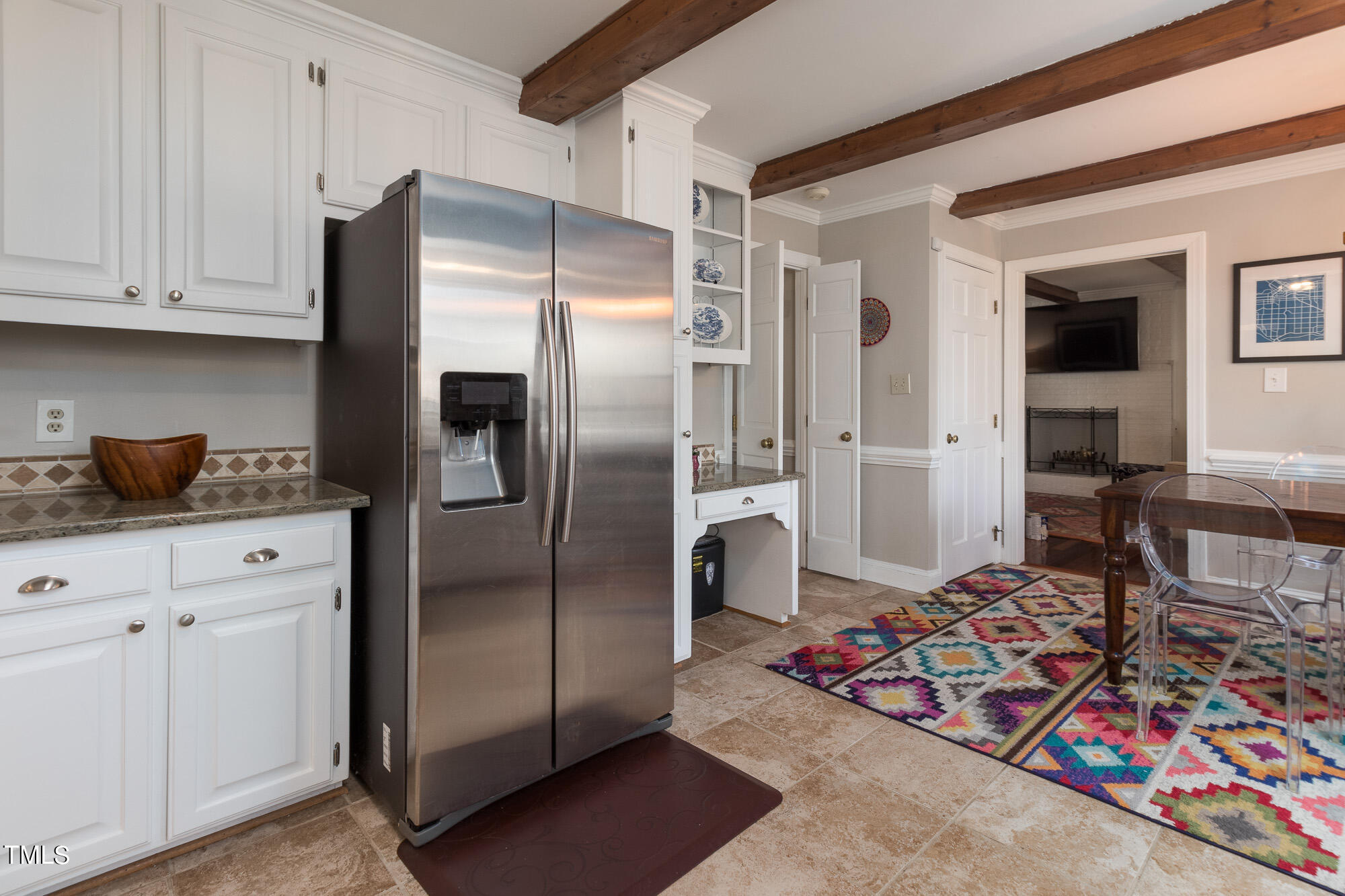 8832 Campfire Trail Raleigh, NC 27615 - Photo 4 of 19 a kitchen with stainless steel appliances granite countertop a refrigerator and a stove