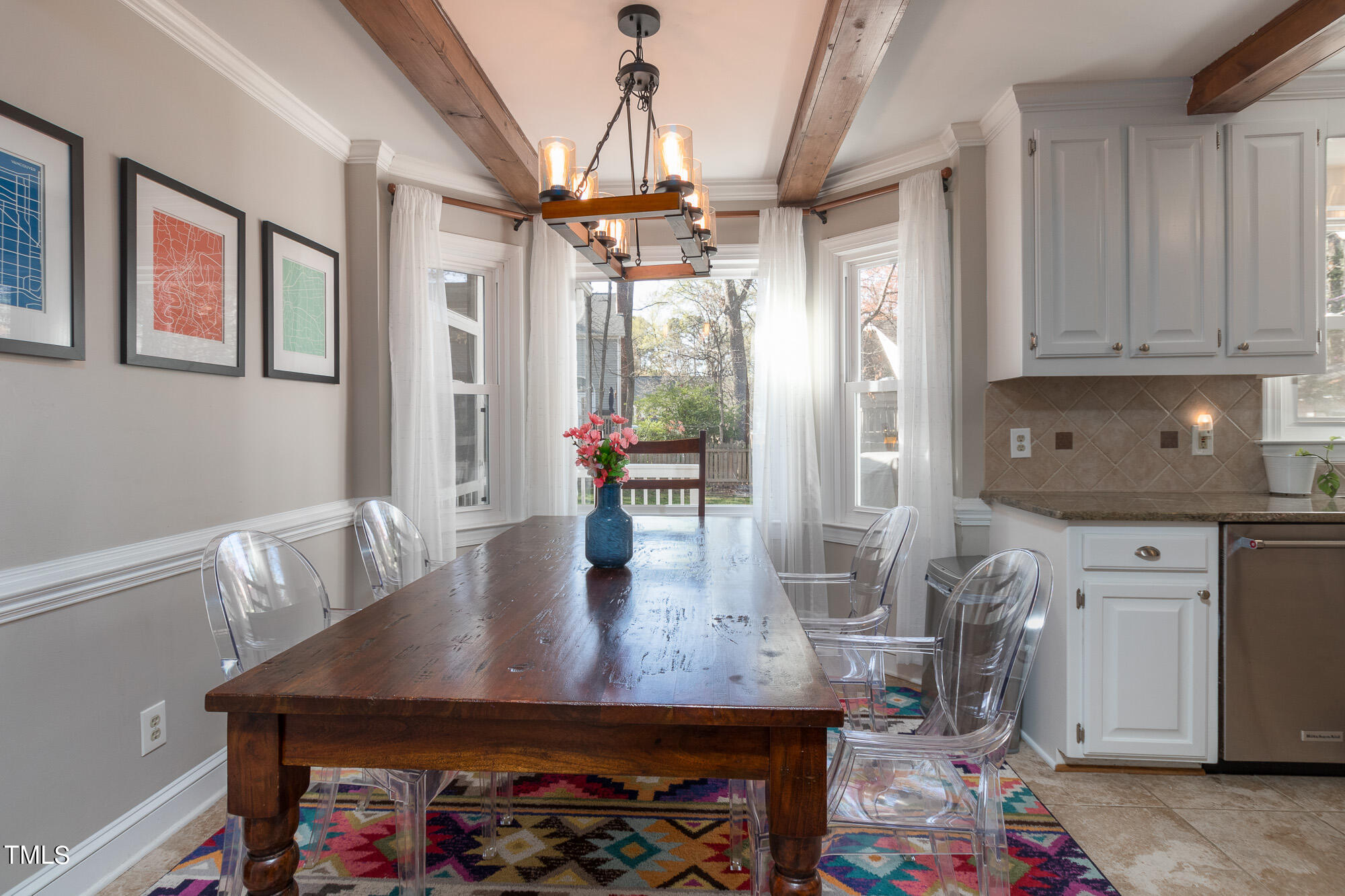 8832 Campfire Trail Raleigh, NC 27615 - Photo 5 of 19 a view of a dining room with furniture and a chandelier