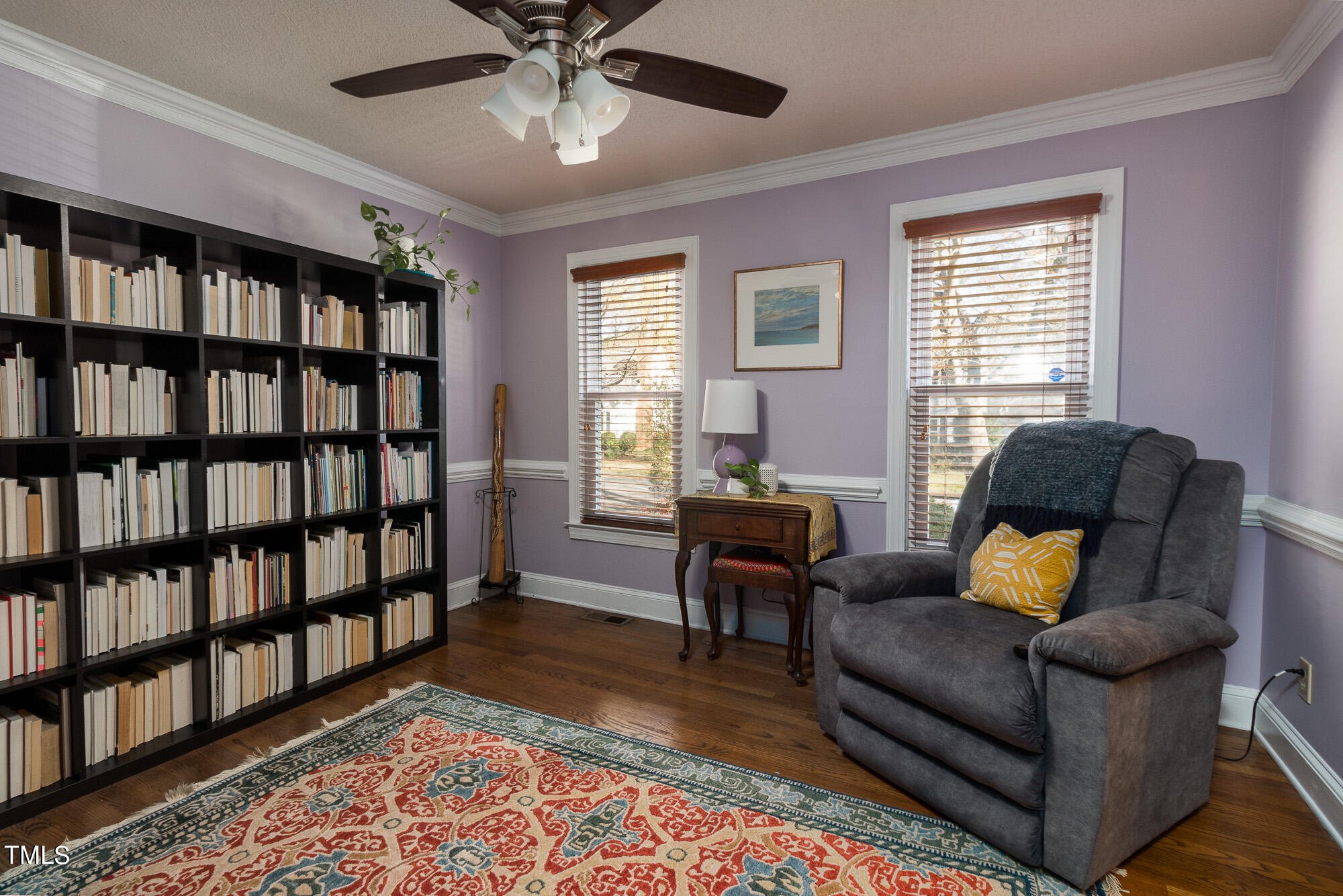 8832 Campfire Trail Raleigh, NC 27615 - Photo 7 of 19 a living room with furniture and a book shelf