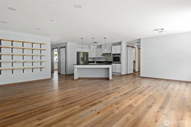 a view of a kitchen with wooden floor