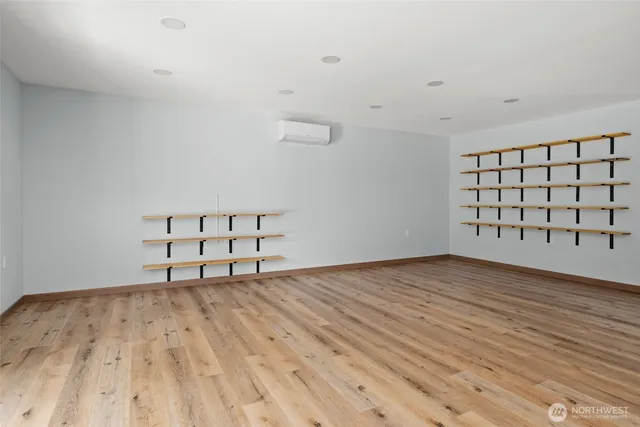 a view of a room with wooden floor